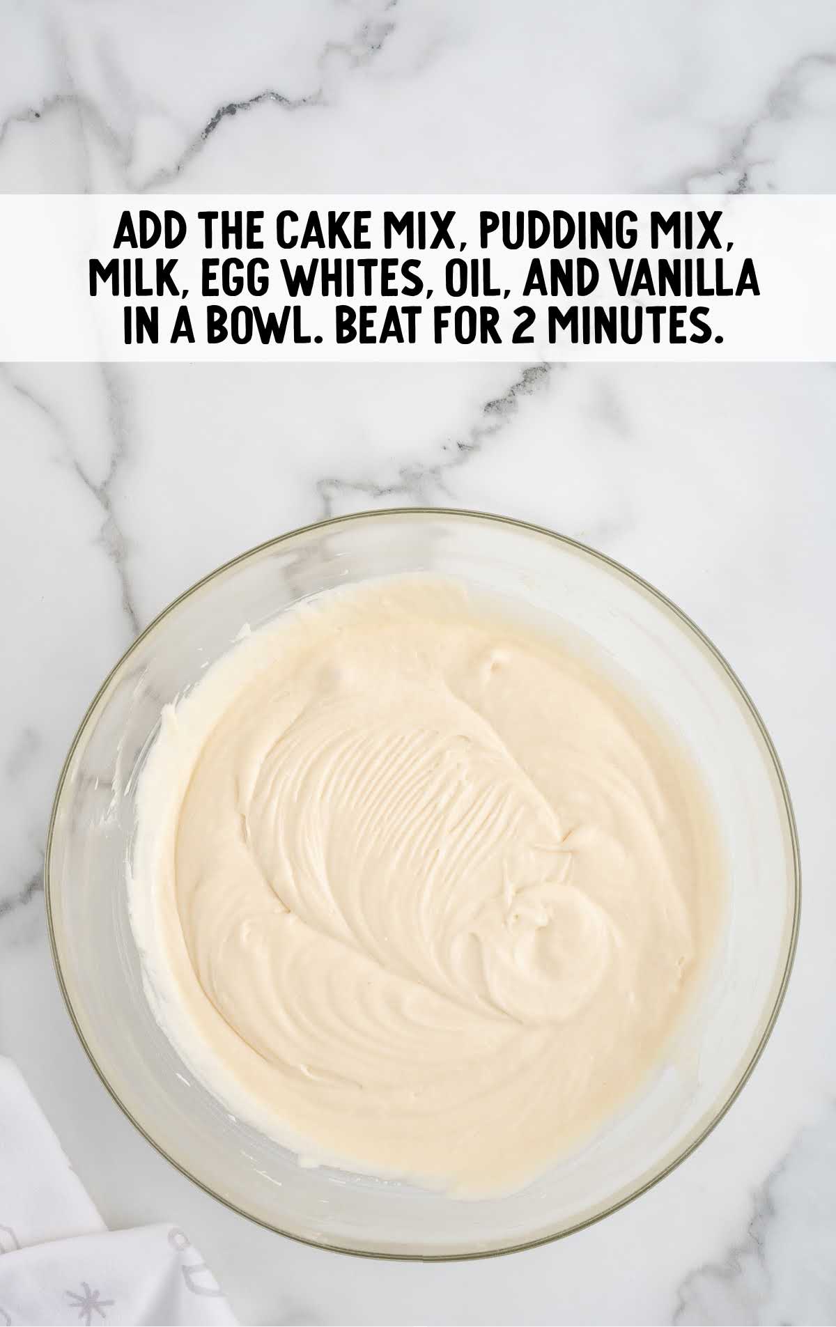 cake mix, pudding mix, milk, egg white oil added to a bowl