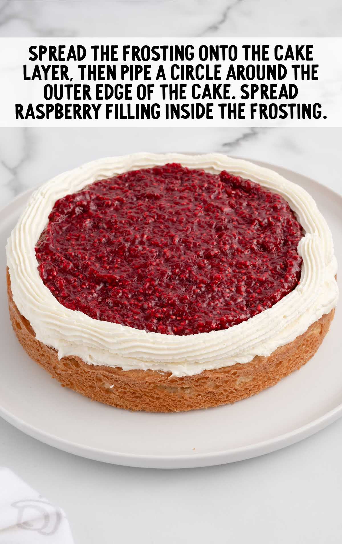 raspberry filing spread inside the frosting