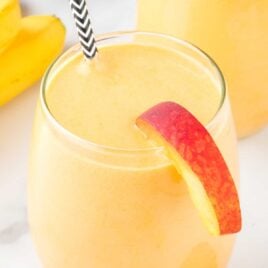 close up shot of Banana Peach Smoothie in a glass
