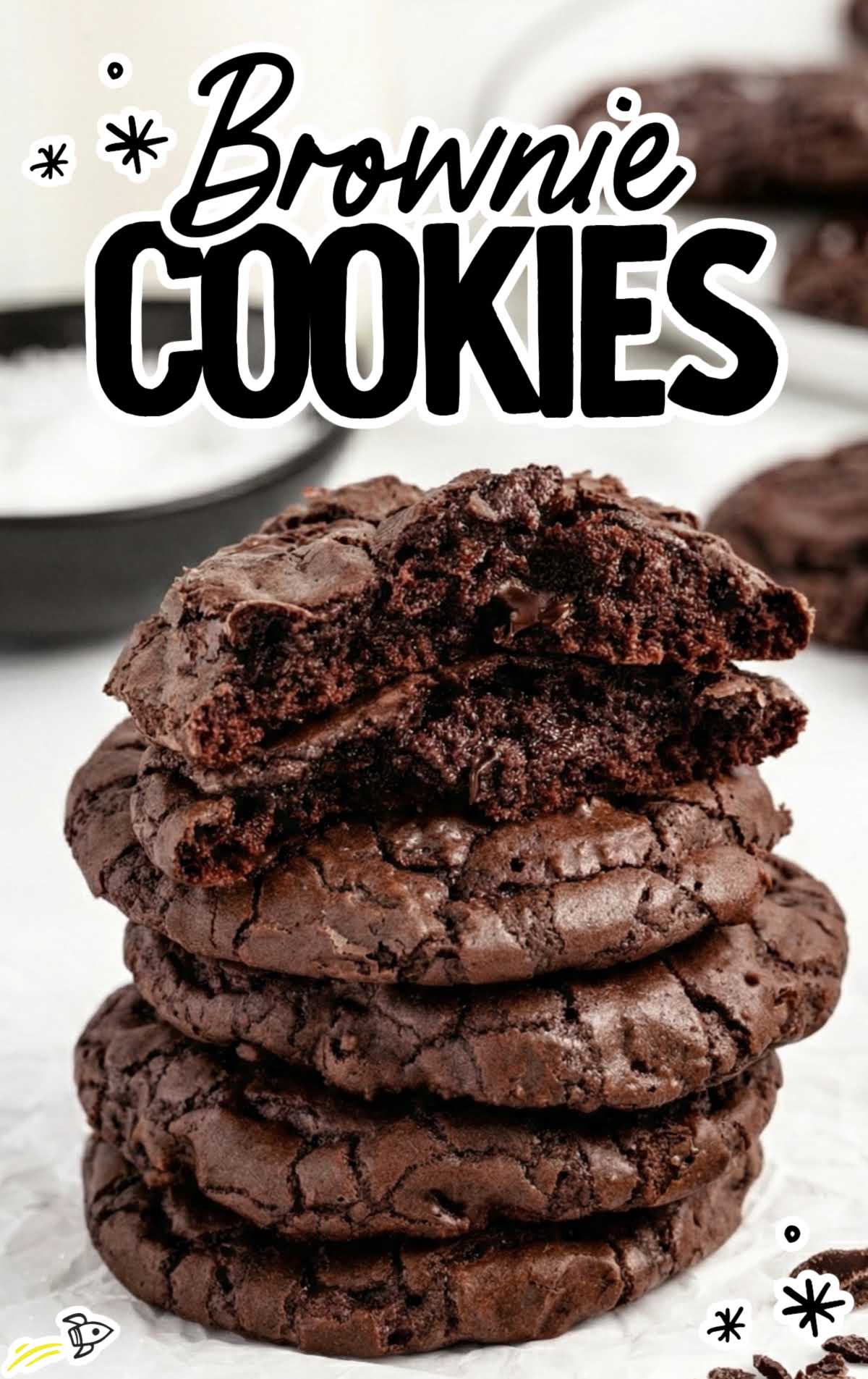 Stack of soft and chewy brownie cookies with a bite showing the fudgy center.