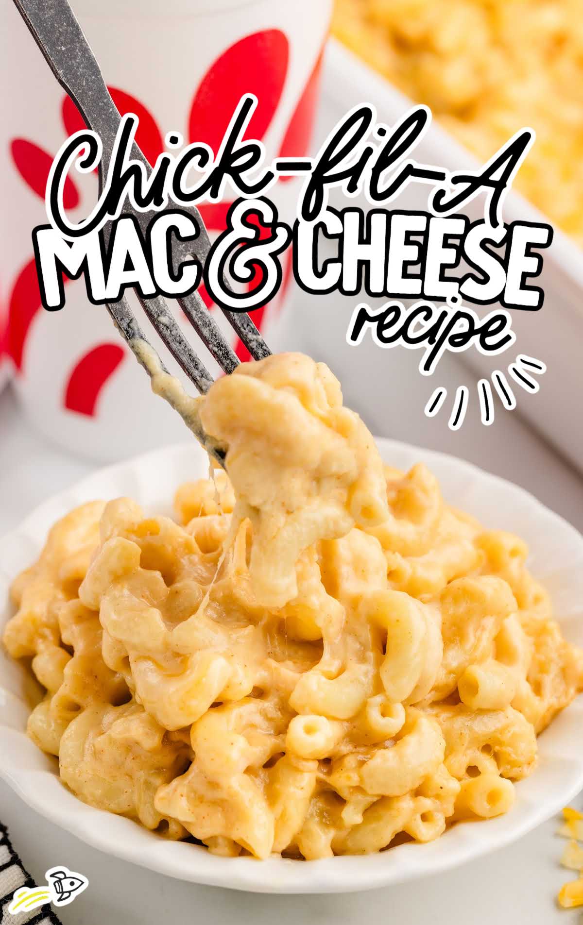 a bowl of Mac and cheese with a fork