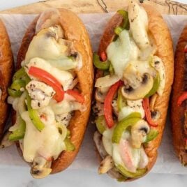 overhead up shot of a couple of Chicken Cheesesteaks on a cutting board
