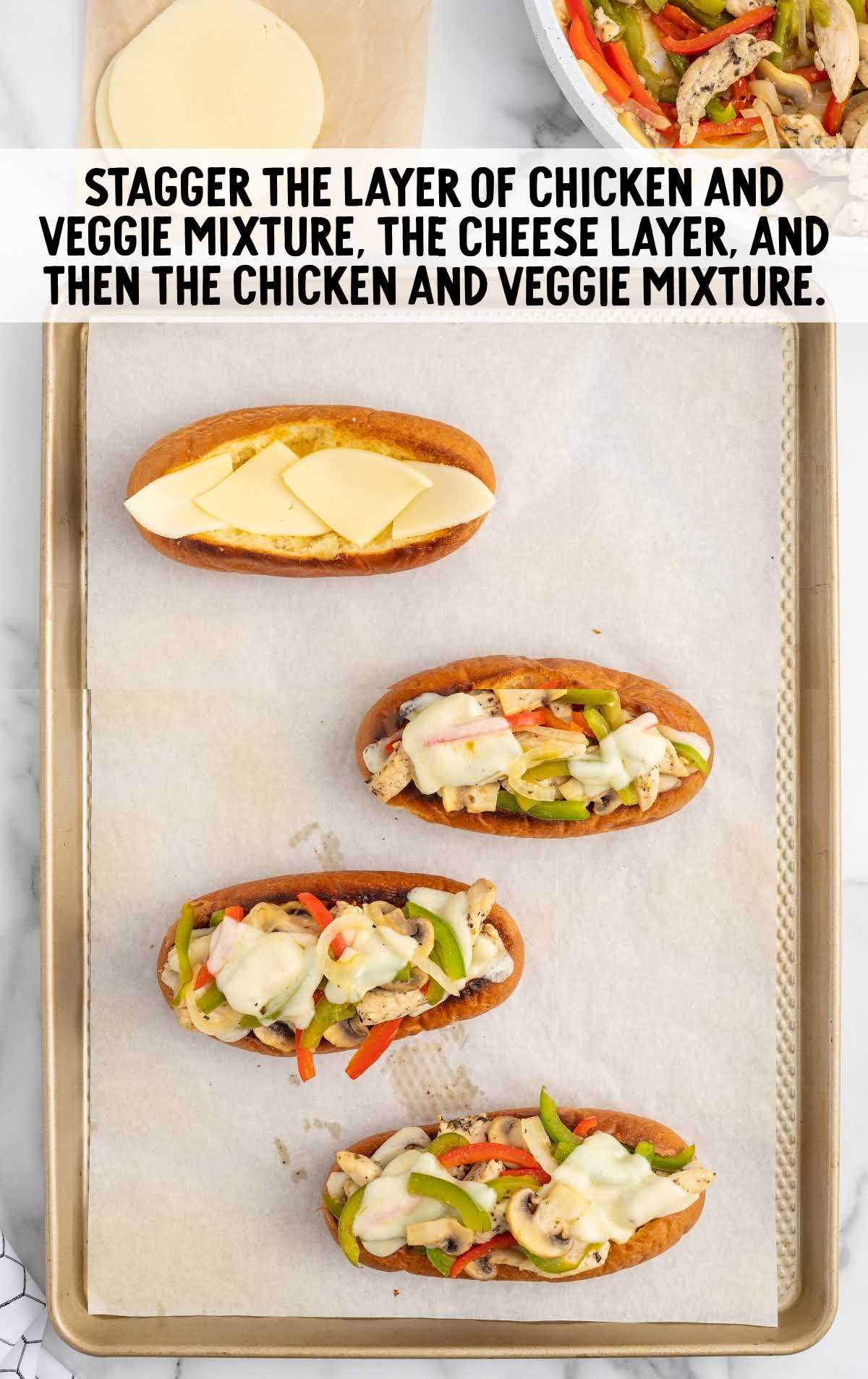 chicken and veggie mixture on a baking sheet