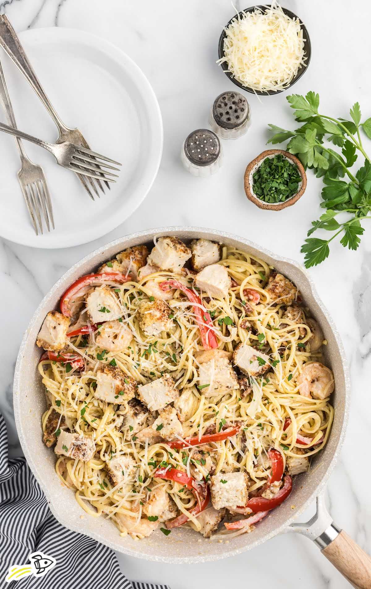 overhead shot of Chicken And Shrimp Carbonara in a pan
