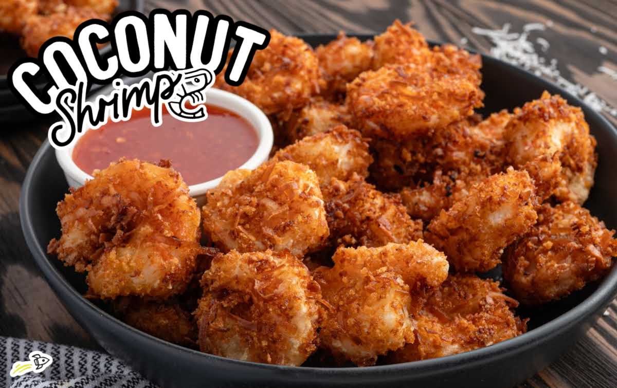 Close-up of crunchy coconut shrimp with toasted coconut coating and dipping sauce