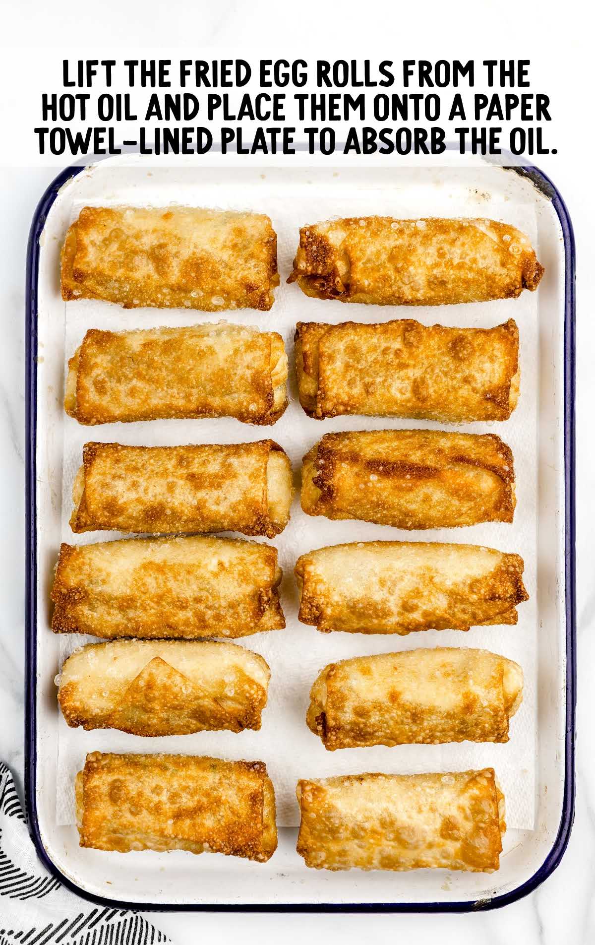 place egg rolls onto a paper towel