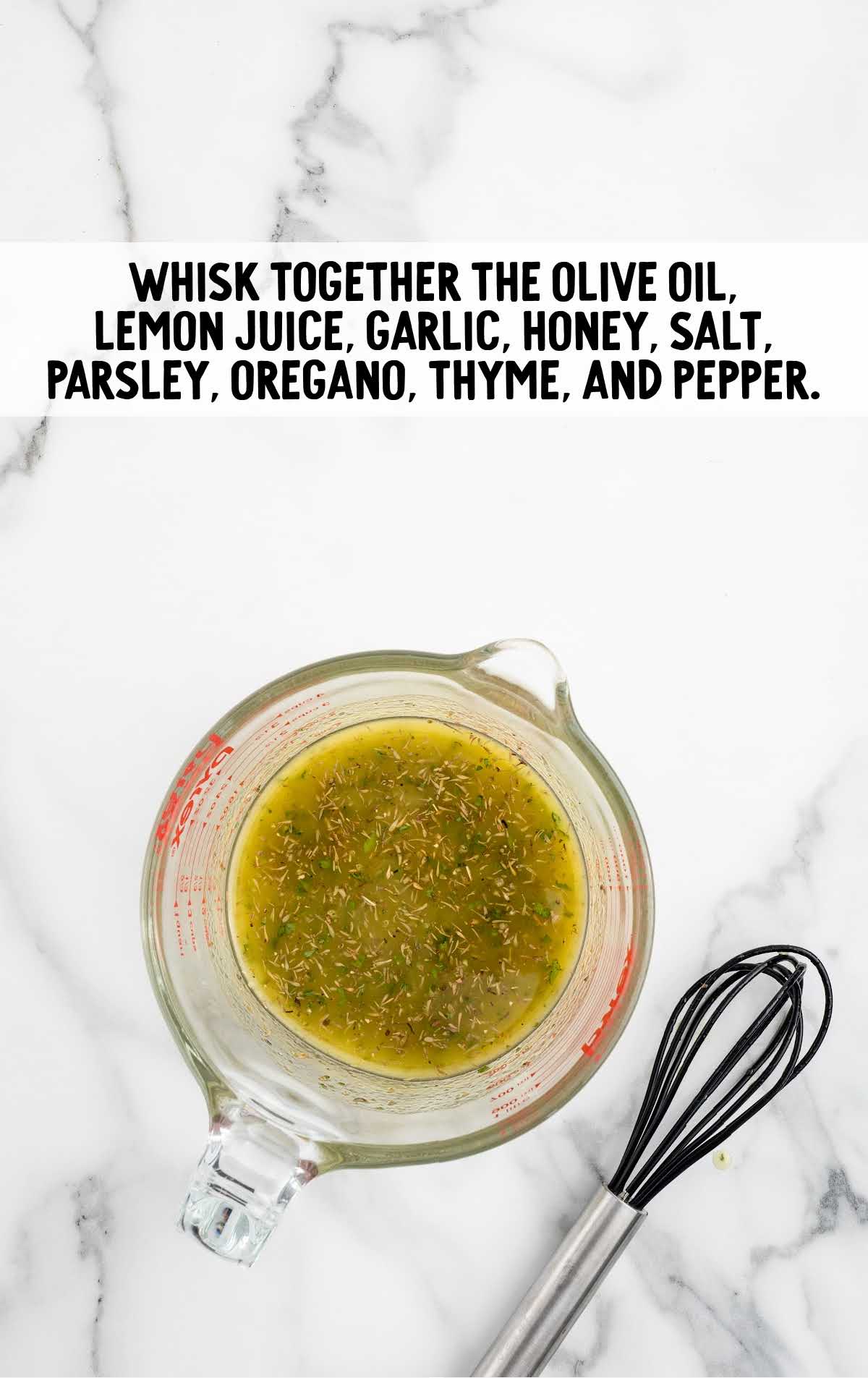 olive oil, lemon juice, garlic, honey, salt, parsley, oregano, thyme, and pepper whisked together