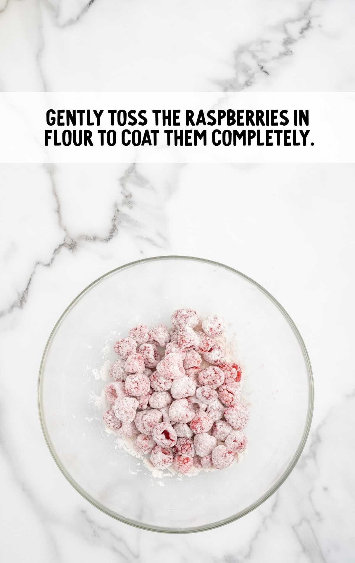 raspberries coated with flour in a bowl