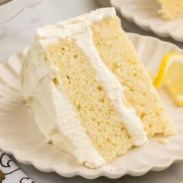 a close up shot of a slice of Limoncello Cake on a plate