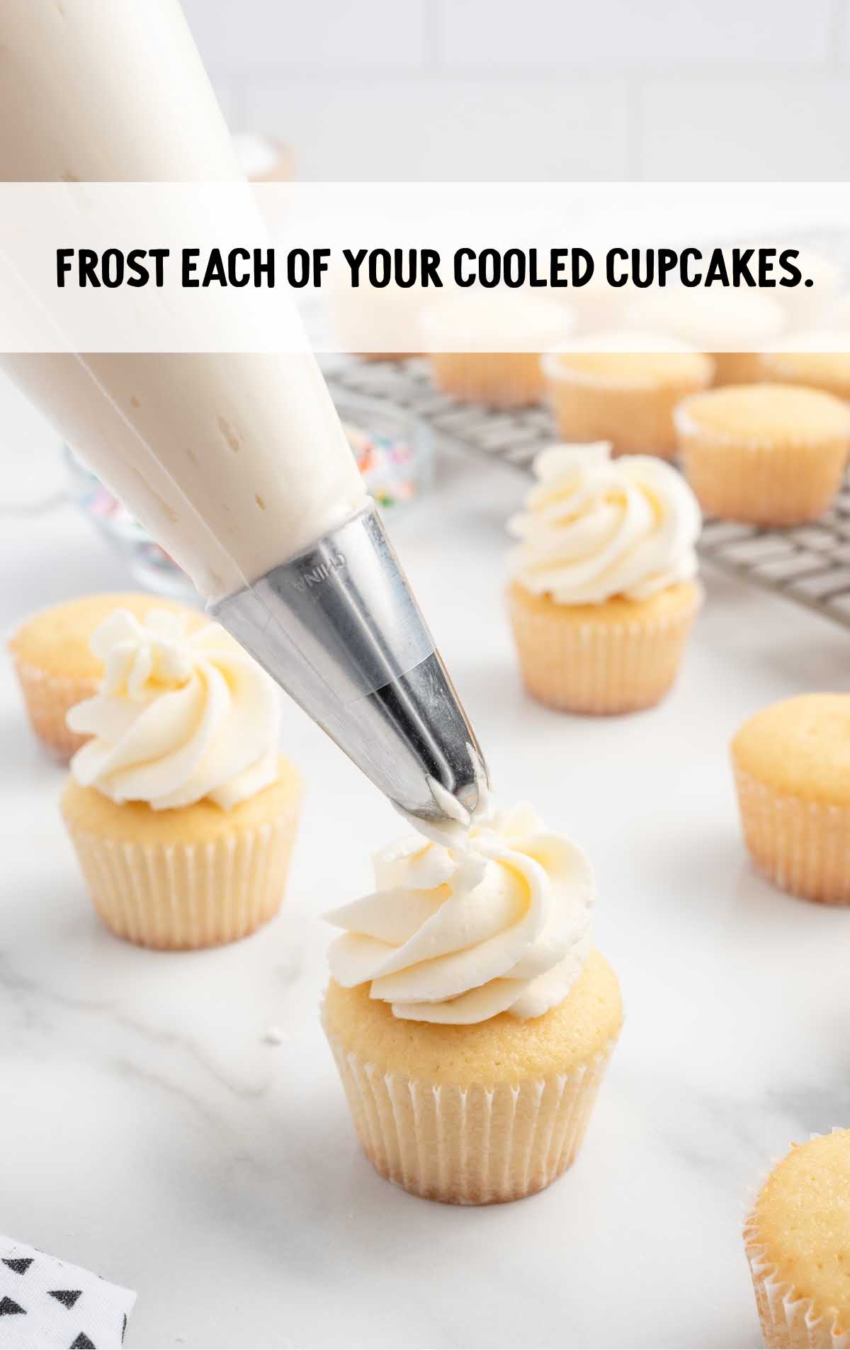 top the mini cupcakes with frosting