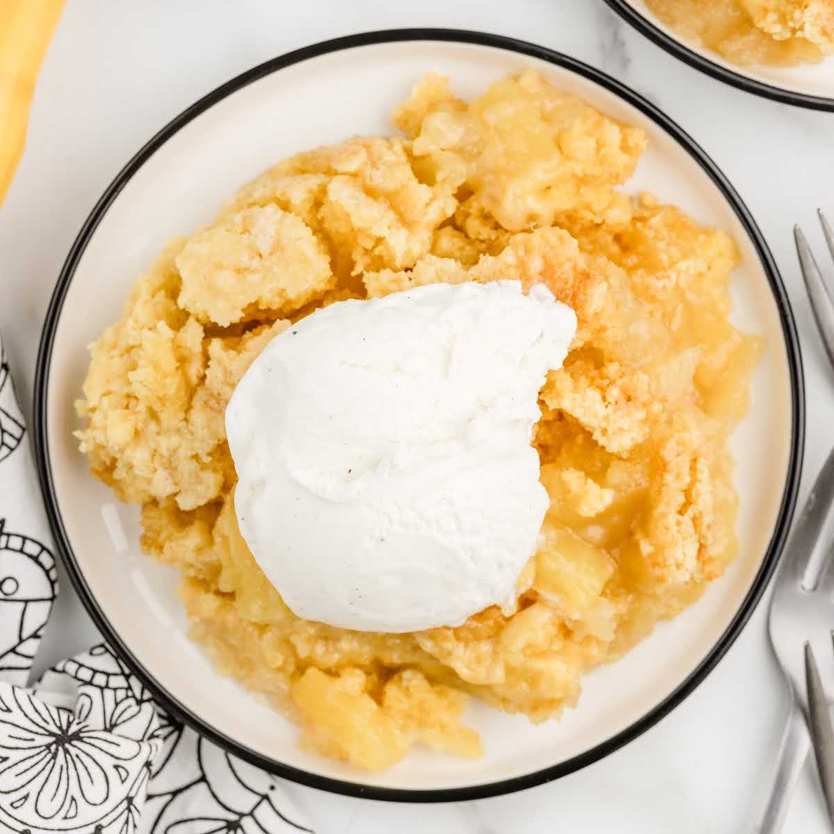 overhead shot of a slice of Pineapple Dump Cake on a plate