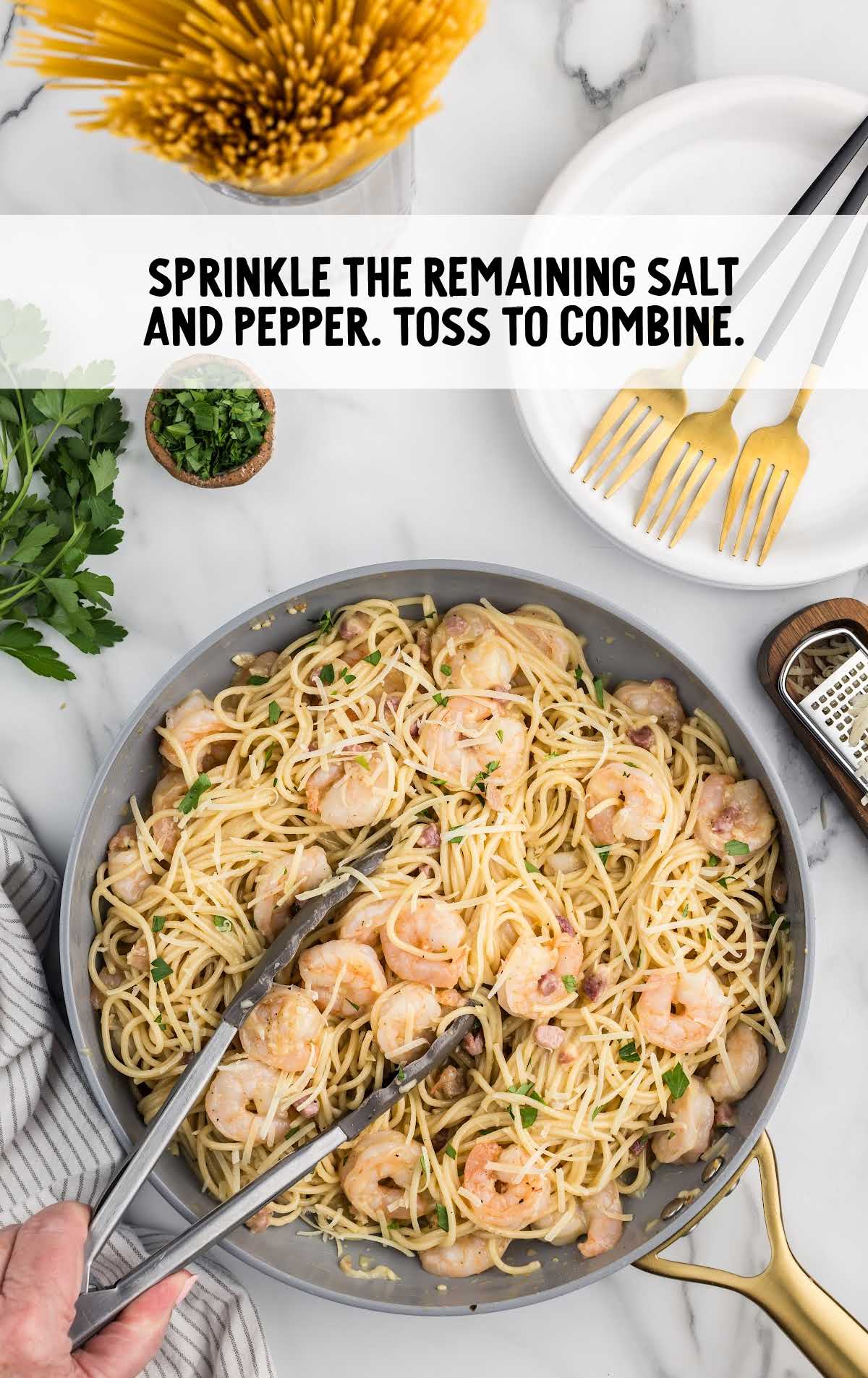 salt and pepper sprinkled into pasta and toss