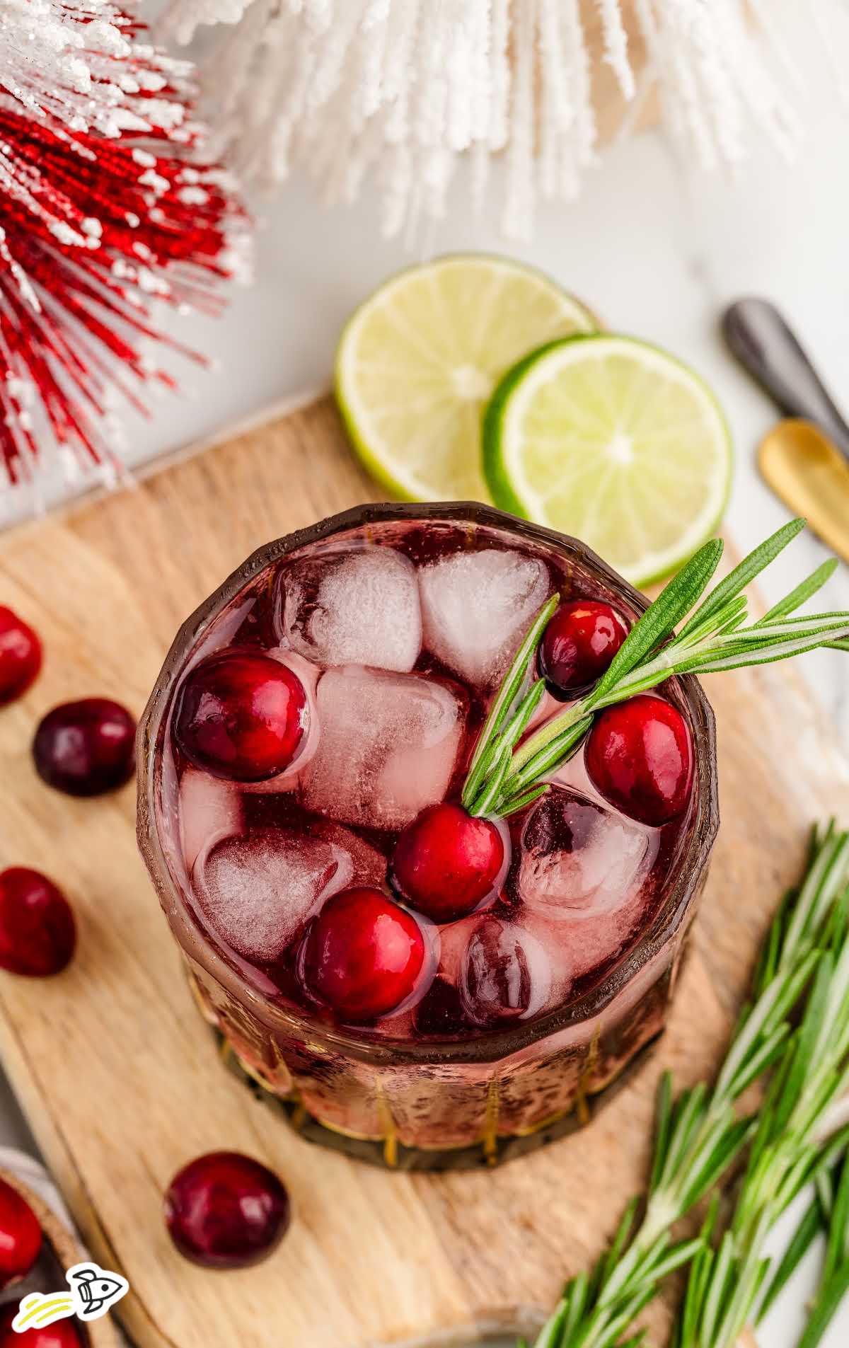 a glass of Vodka Cranberry garnished with cranberries 