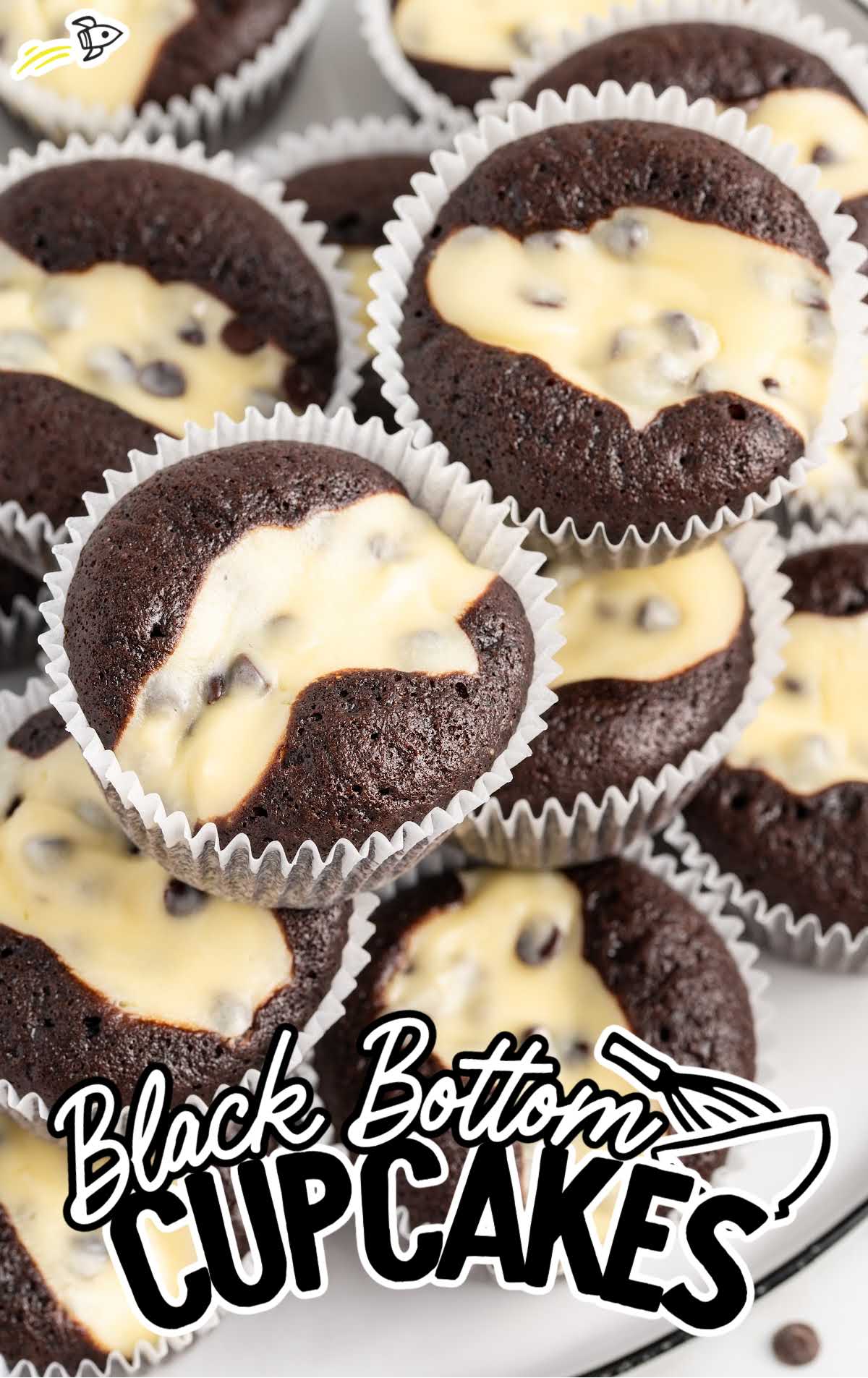 a close up shot of Black Bottom Cupcakes stacked on top of each other.