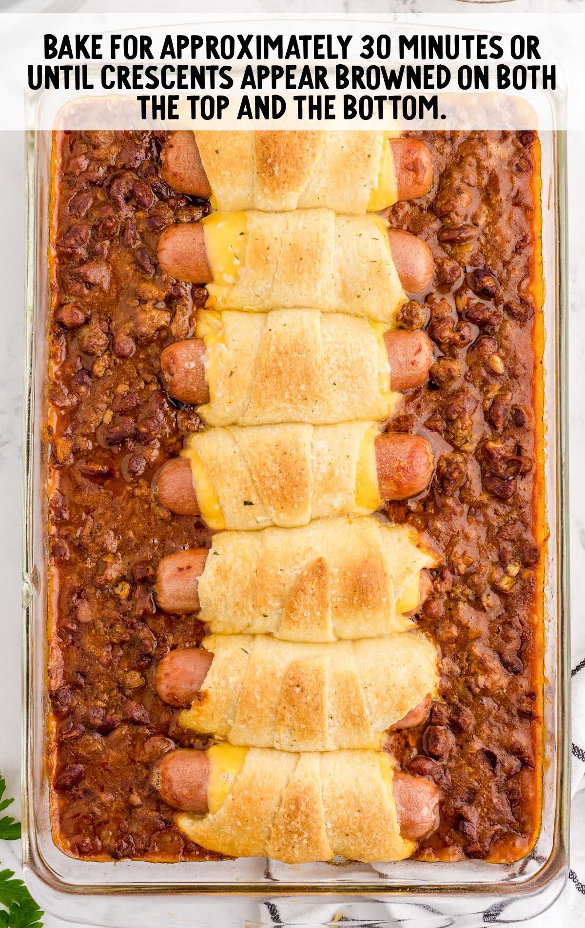 chili cheese dog bake is baked in a baking dish