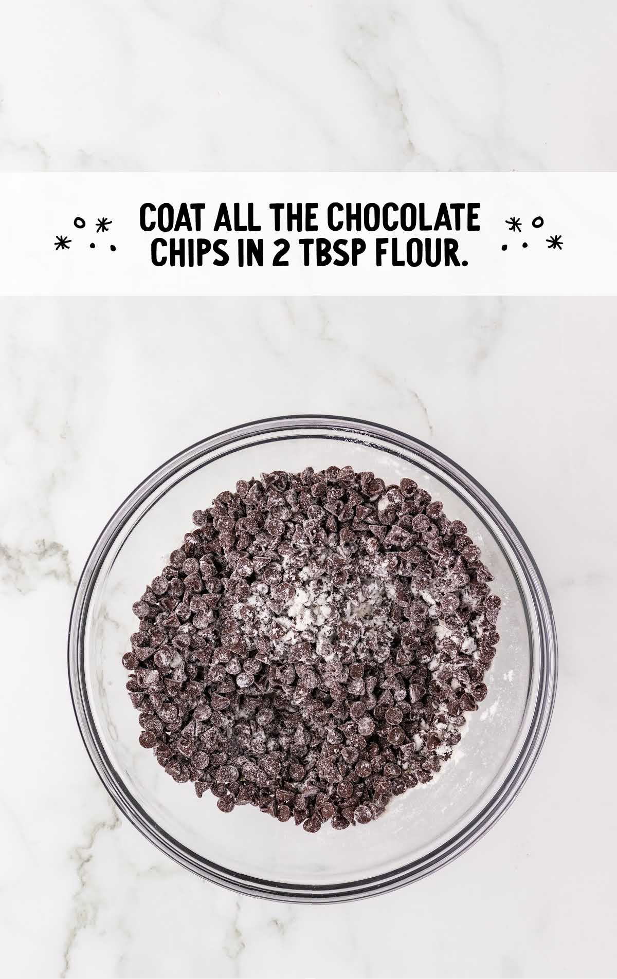 chocolate chips coated in a bowl of flour