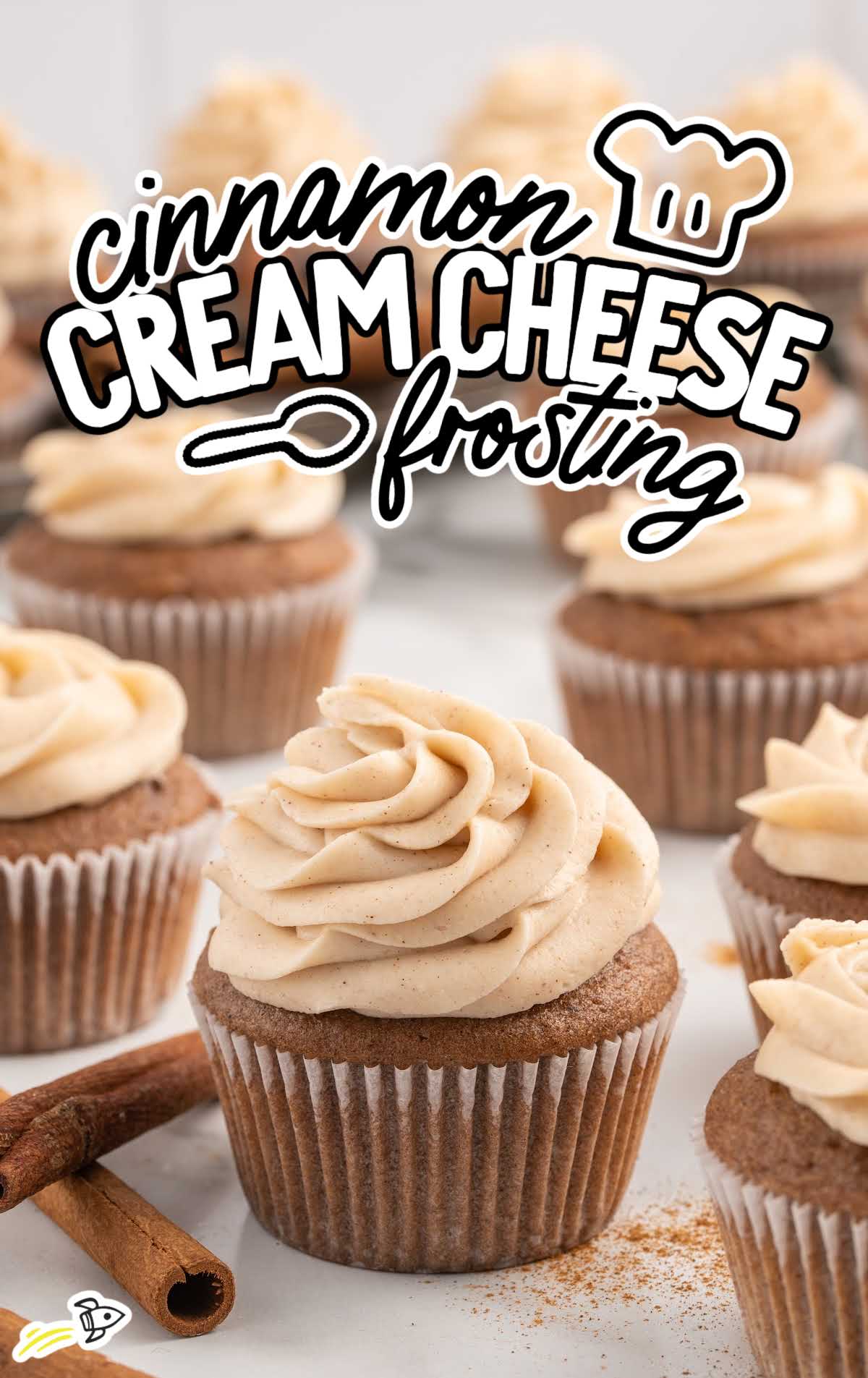 a cupcake topped with Cinnamon Cream Cheese Frosting