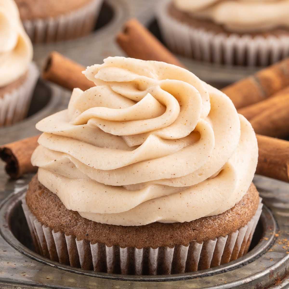 A stack of pancakes on a plate, with Cream