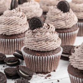 frosted cupcakes topped with Oreos