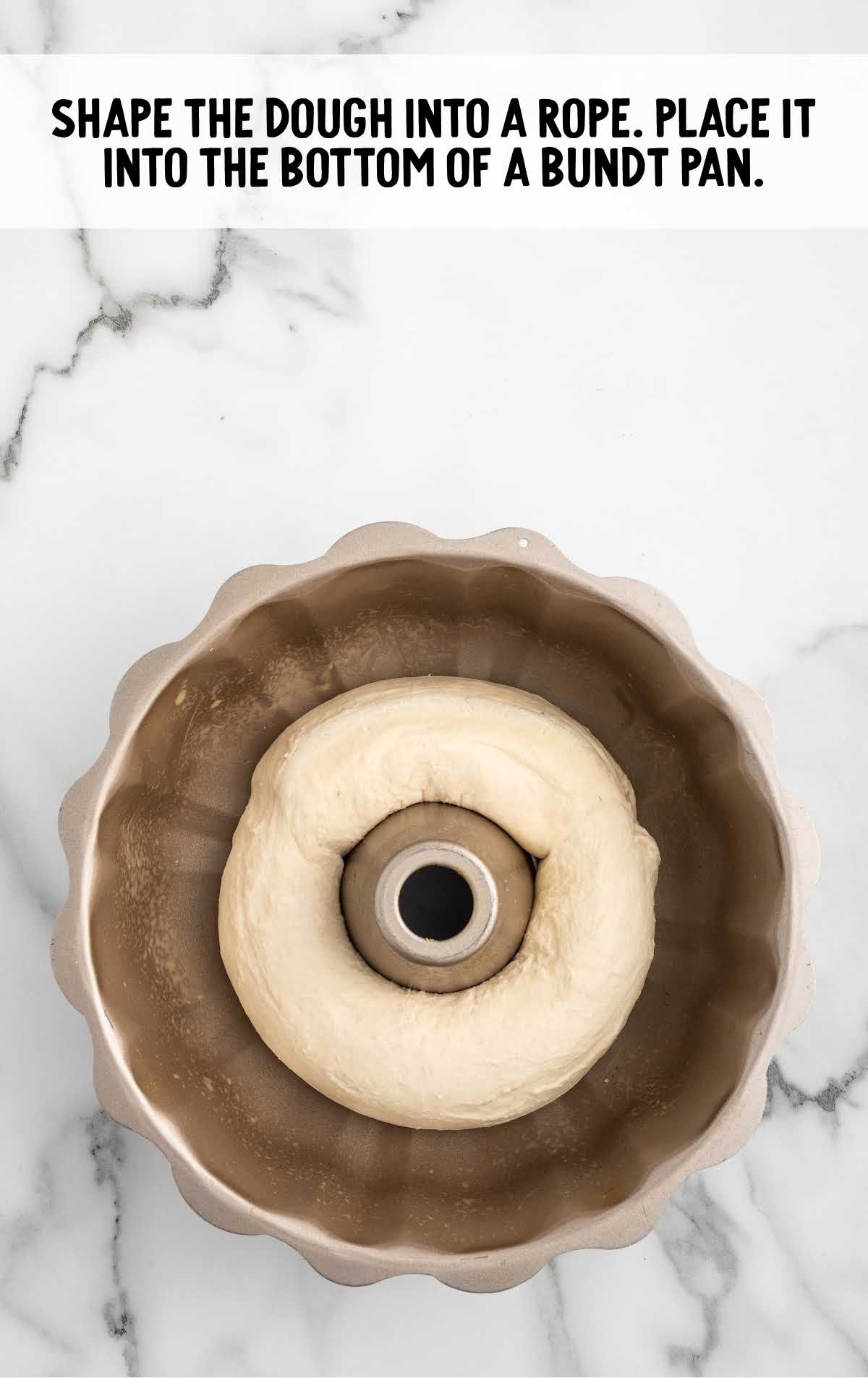 dough shaped into a rope and placed in a bundt pan