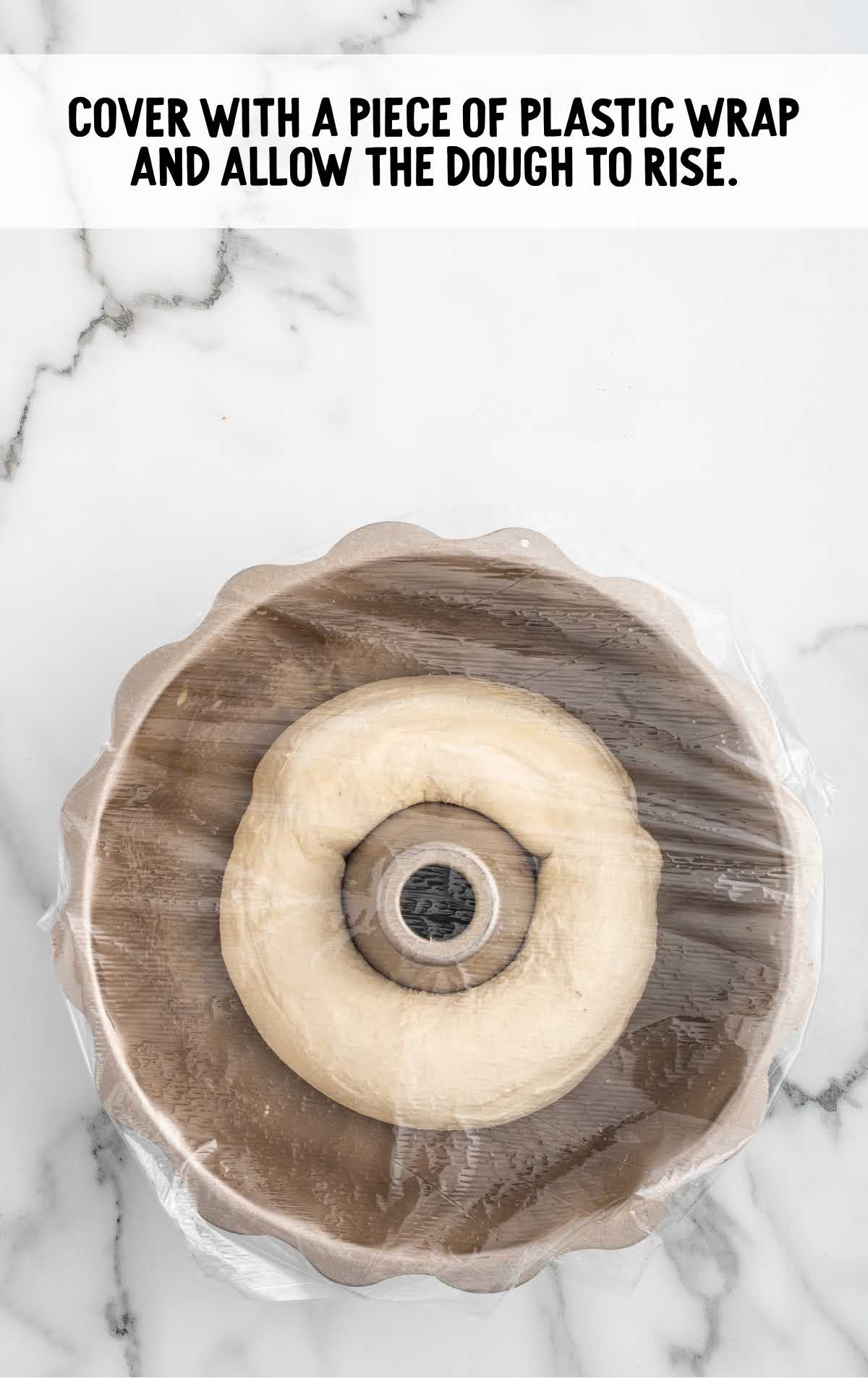 plastic wrap placed on top of the bundt pan