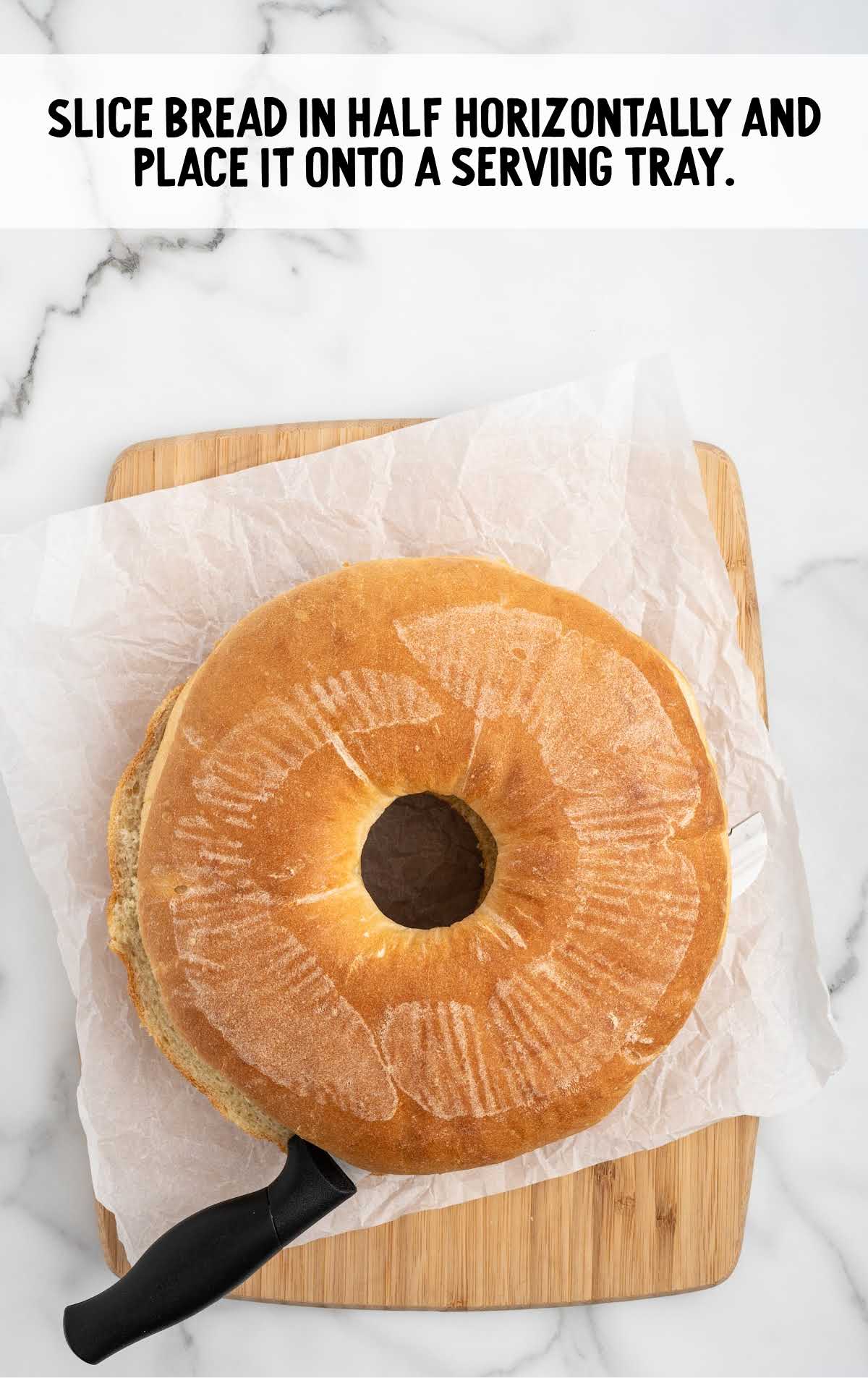 bread loaf cut in half horizontally and placed on a serving tray