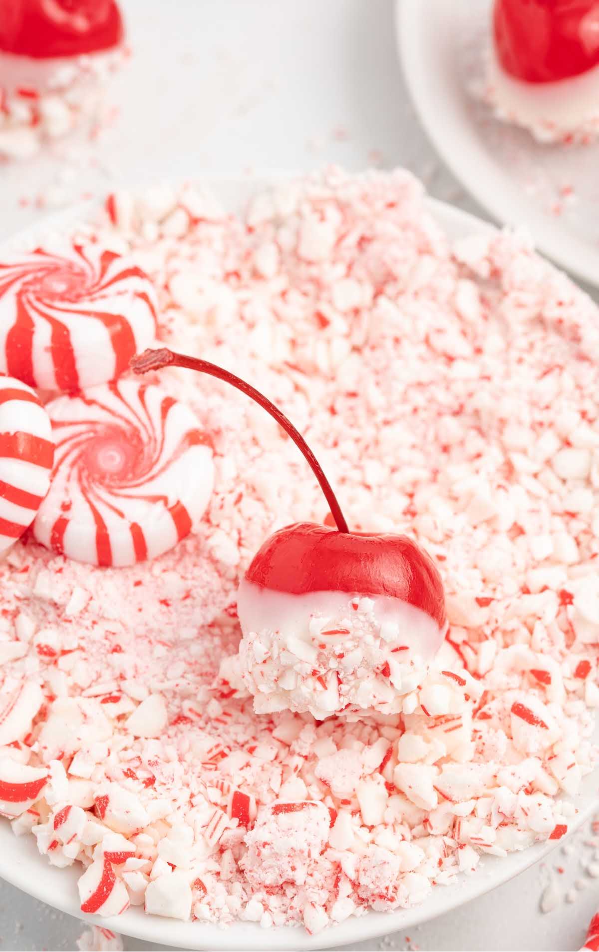a close upshot of a cherry bomb on a plate filled with peppermint
