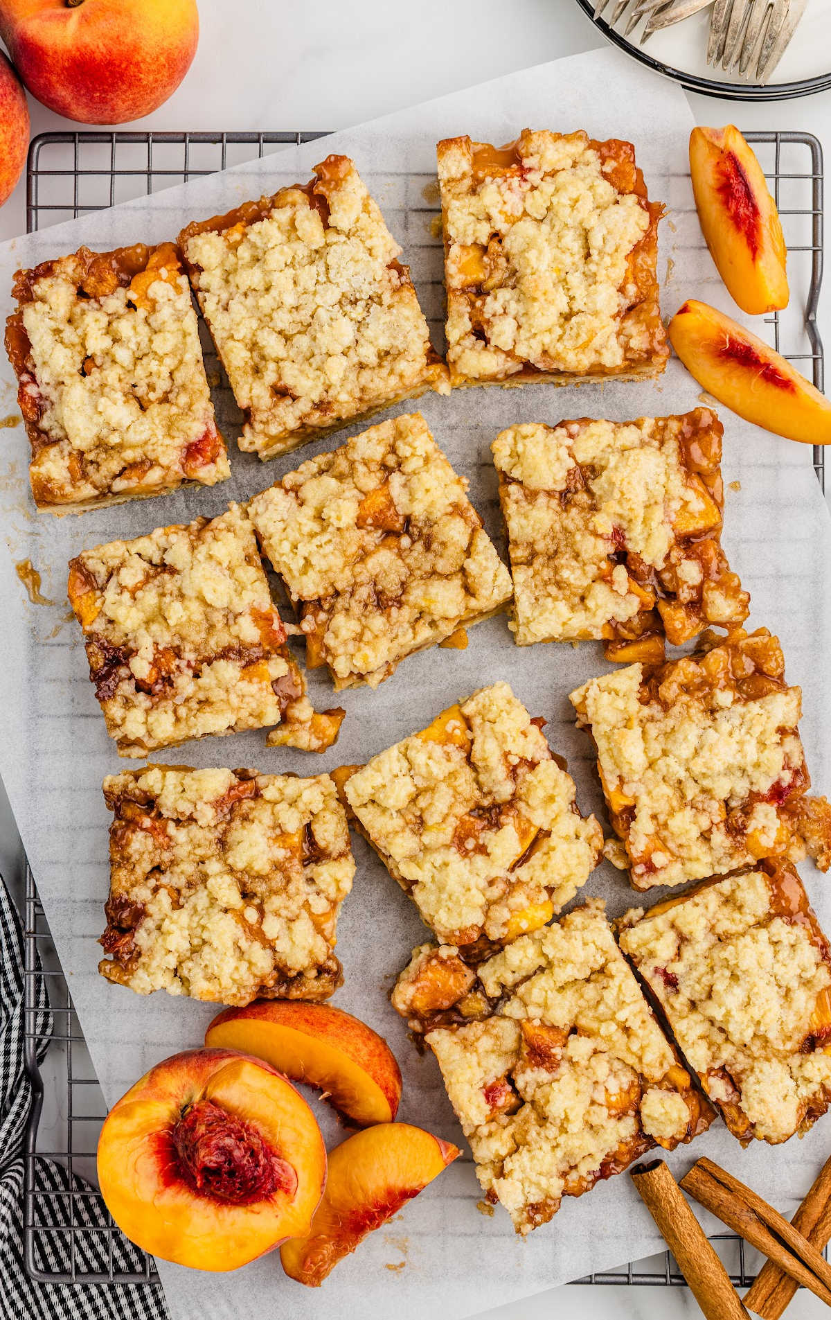 peach bars with peaches on a cooling rack