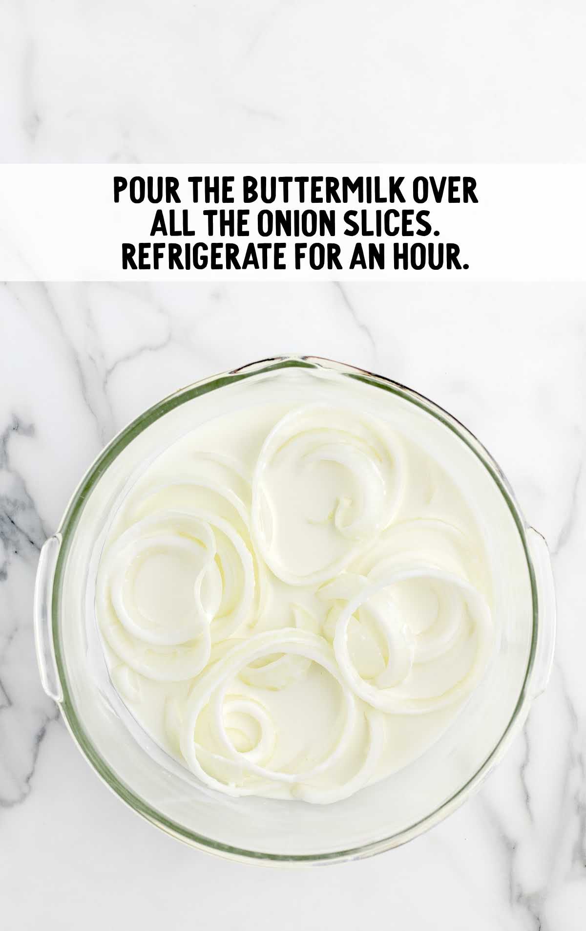 a bowl of buttermilk and onion slices