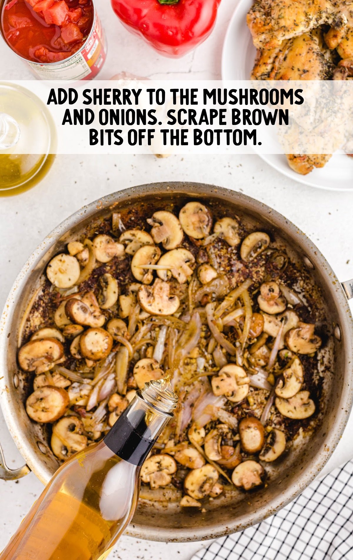pouring sherry into a pan with mushrooms and onions that are cooking