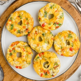 plate of egg bites with meat, veggies, and cheese