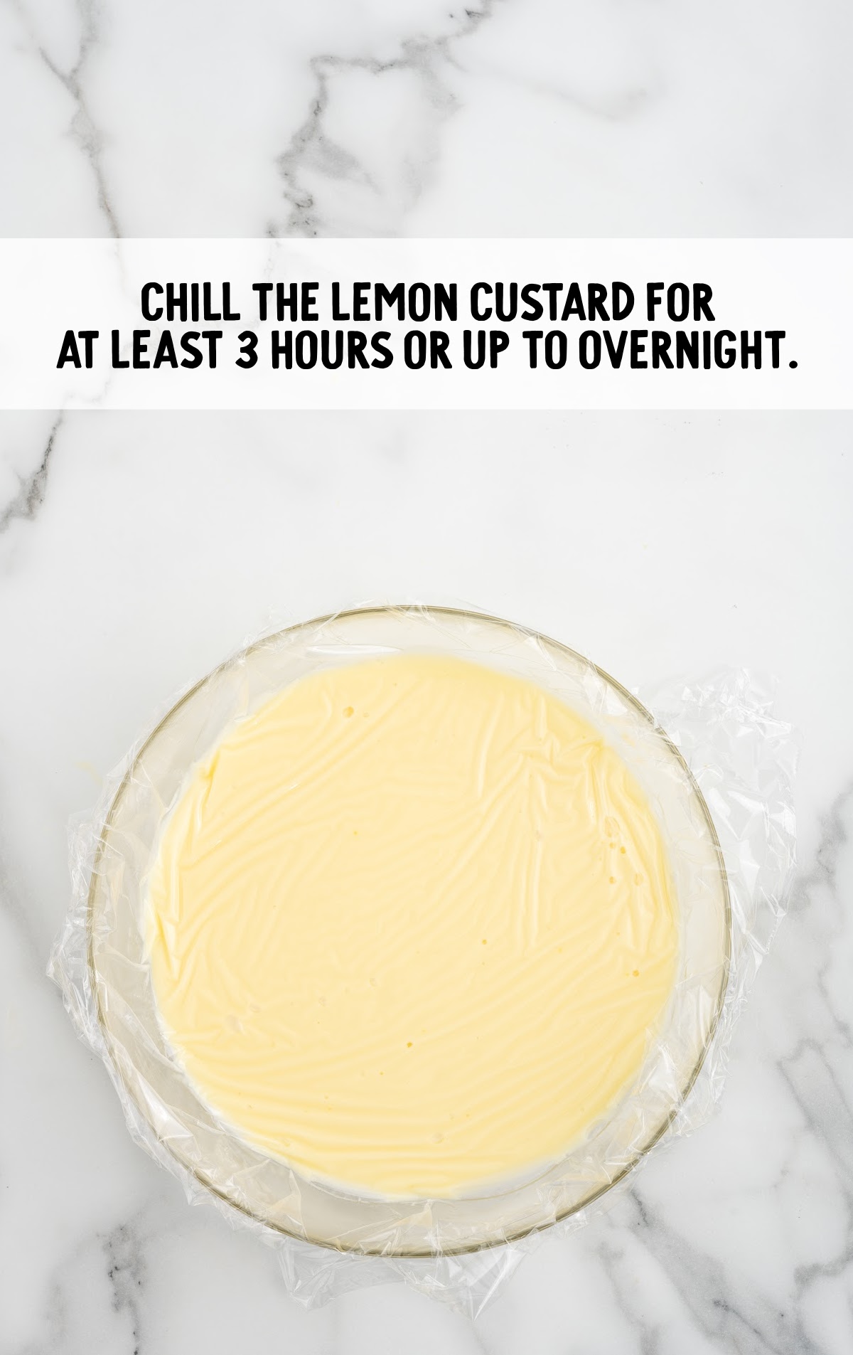 bowl of lemon custard with plastic wrap to chill overnight