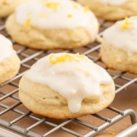 cooling rack with glazed lemon ricotta cookies