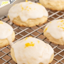 A cooling rack with lemon ricotta cookies.