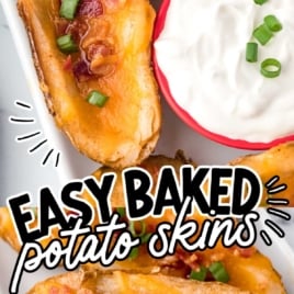 a plate of Baked Potato Skins garnished with green onions and served with a bowl of sour cream