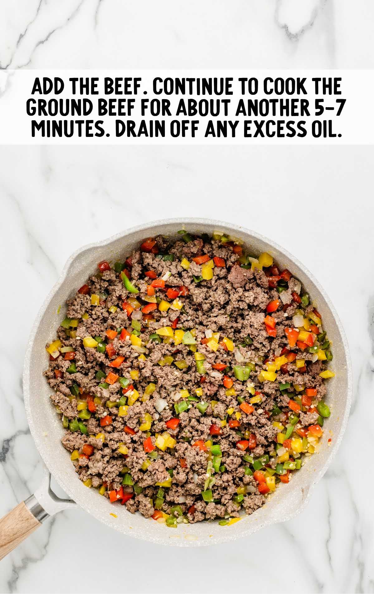 ground beef added to the ingredients in the skillet