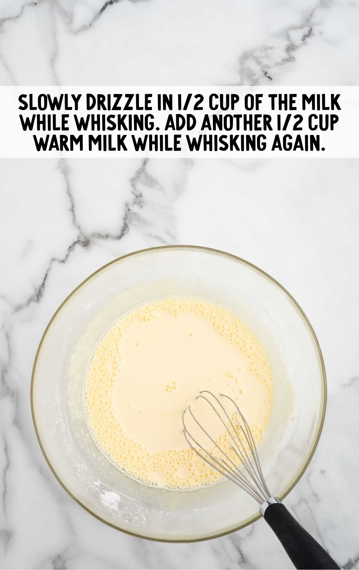 milk whisked in a bowl
