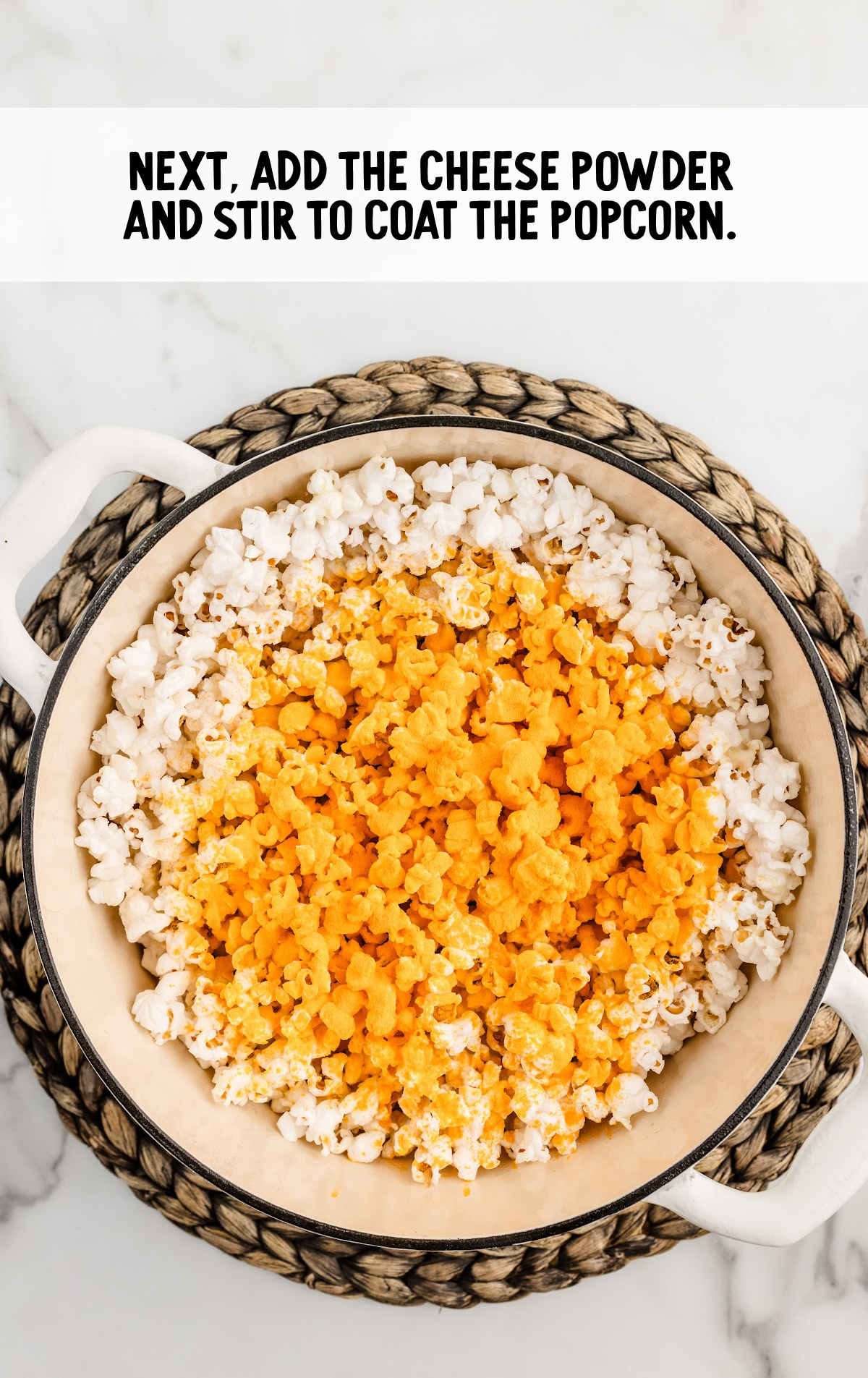 The cheese powder is sprinkled over the cheese popcorn.