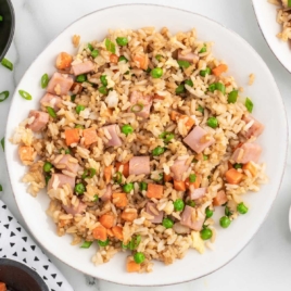 a plate of ham fried rice
