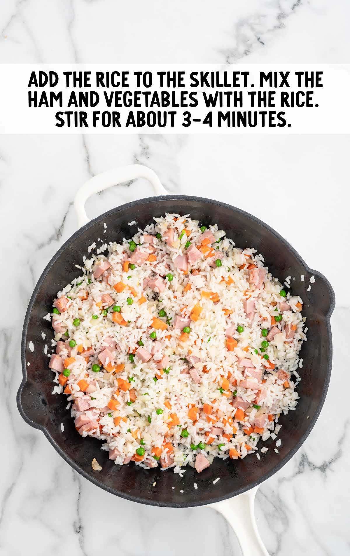 rice added to the skillet of ham and vegetables