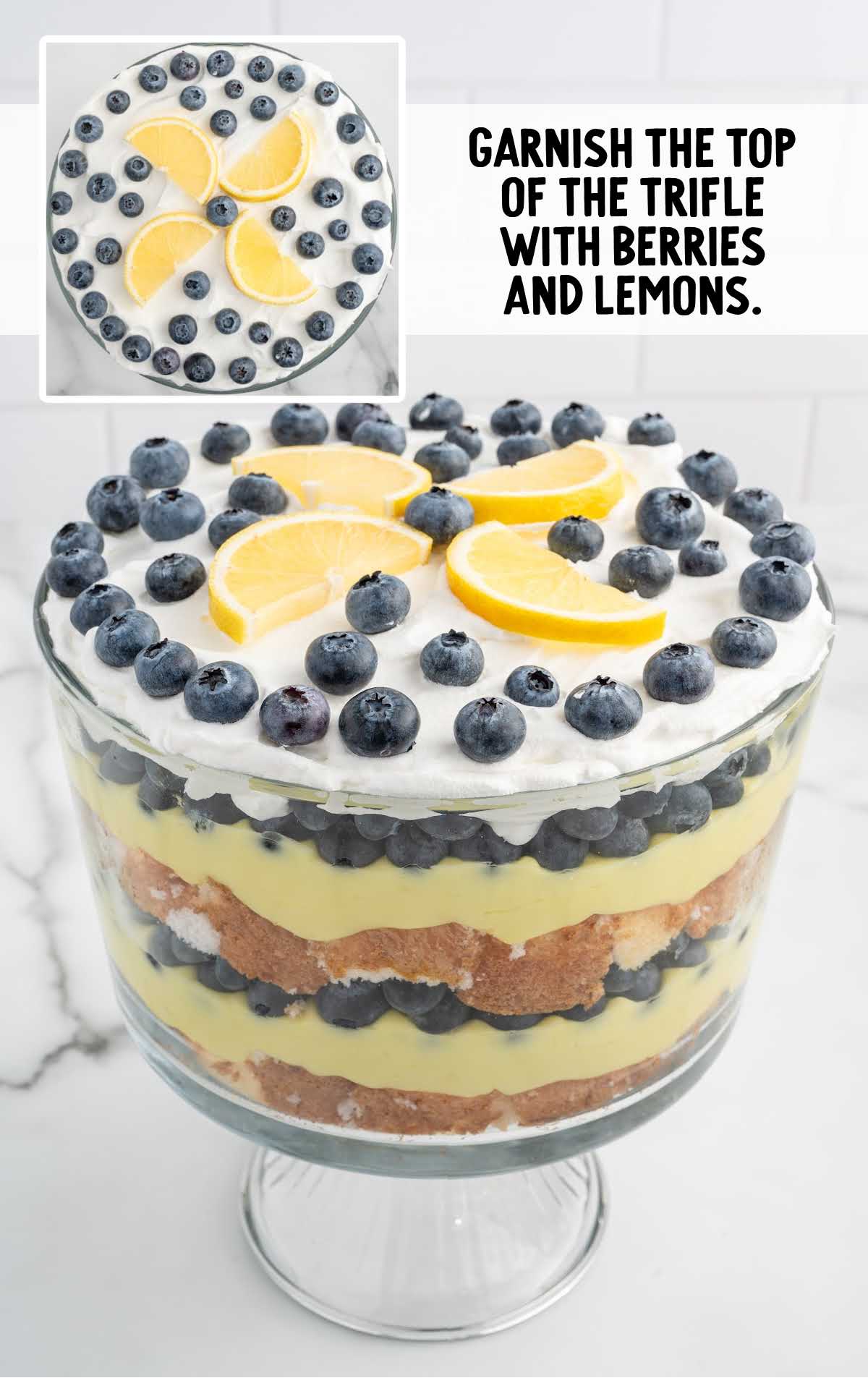 top of the trifle garnished with lemon slices and blueberries