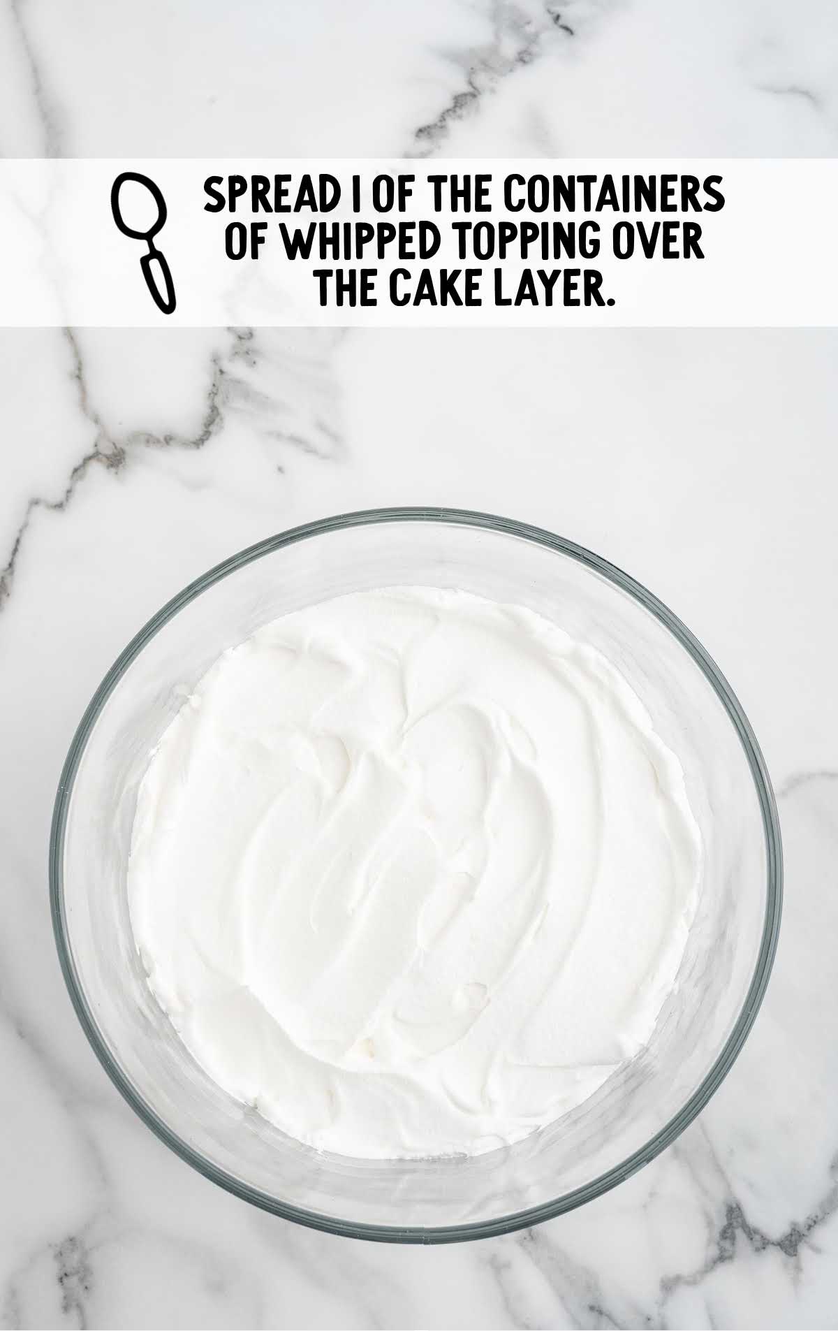whipped topping spread over the cake layer