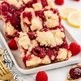 Raspberry Squares piled on a plate