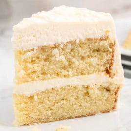 a slice of Vanilla Buttermilk Cake on a plate