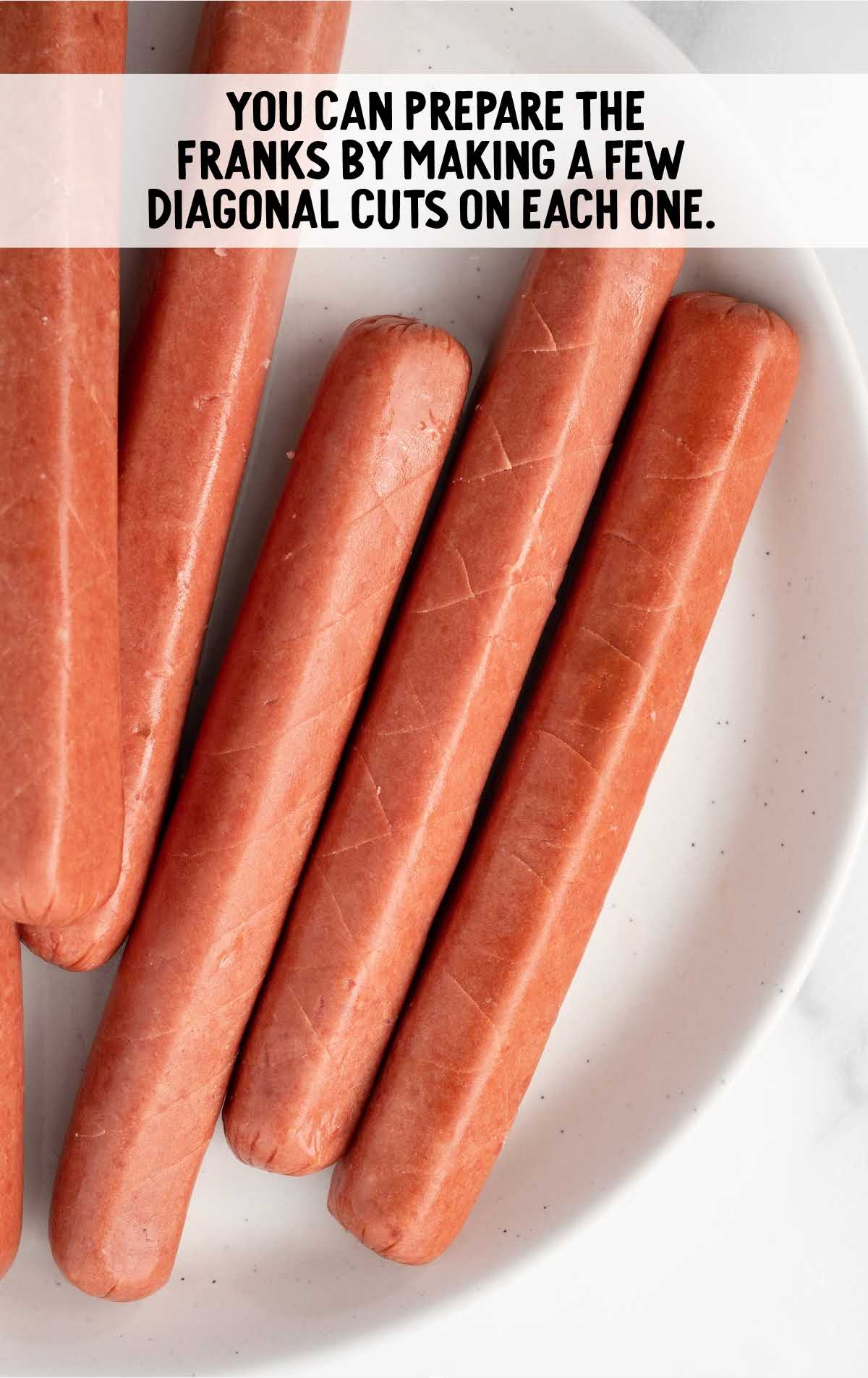 diagonal cuts made on the hot dogs