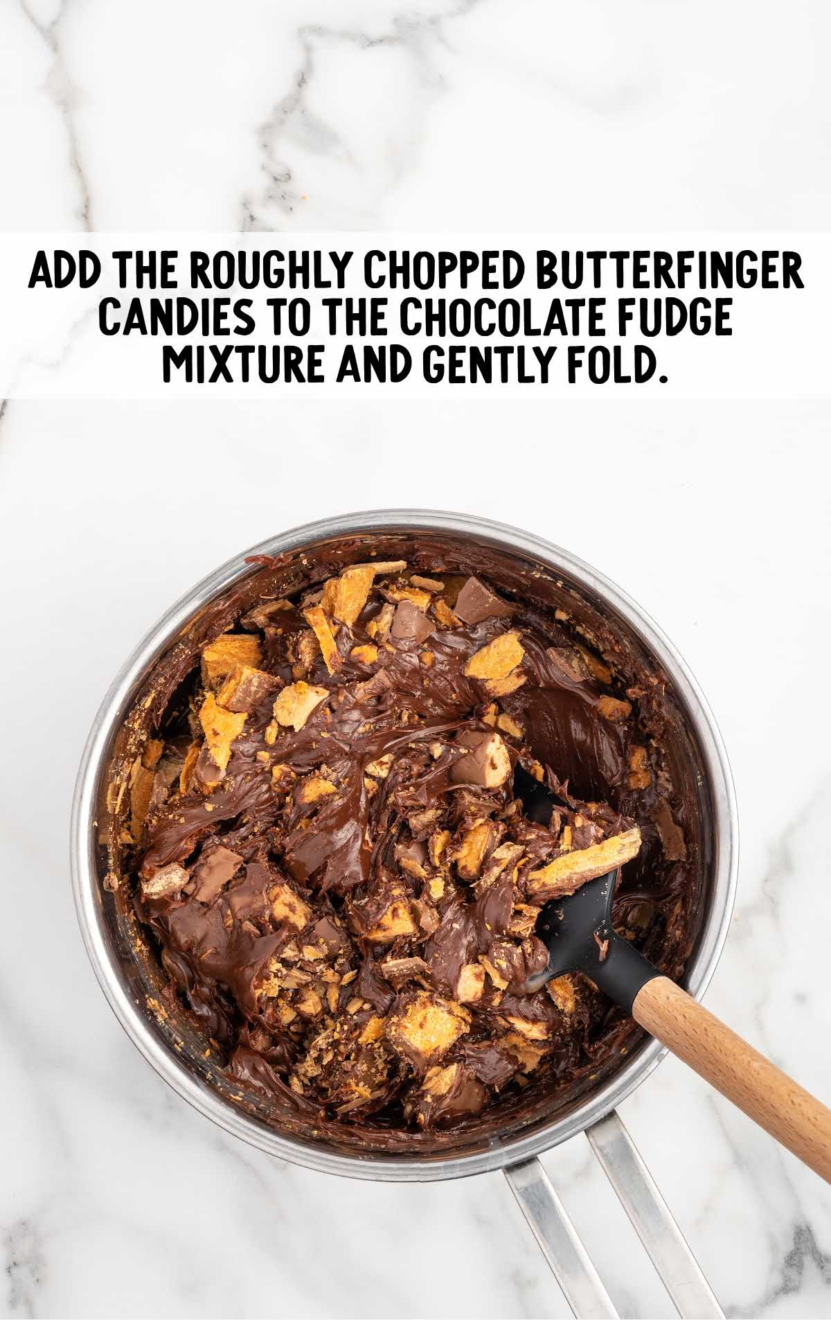 chopped butterfinger candies added to the chocolate fudge mixture in the saucepan