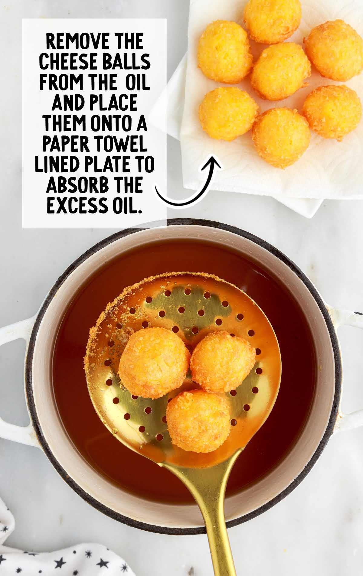 cheese balls removed from oil and placed in a paper towel