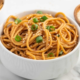 a close up shot of Garlic Sesame Noodles in a bowl