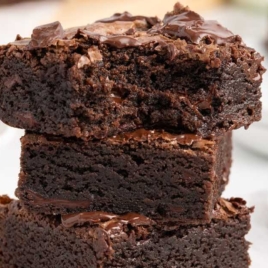 chocolate brownies stacked on top of each other