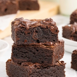 chocolate brownies stacked on top of each other